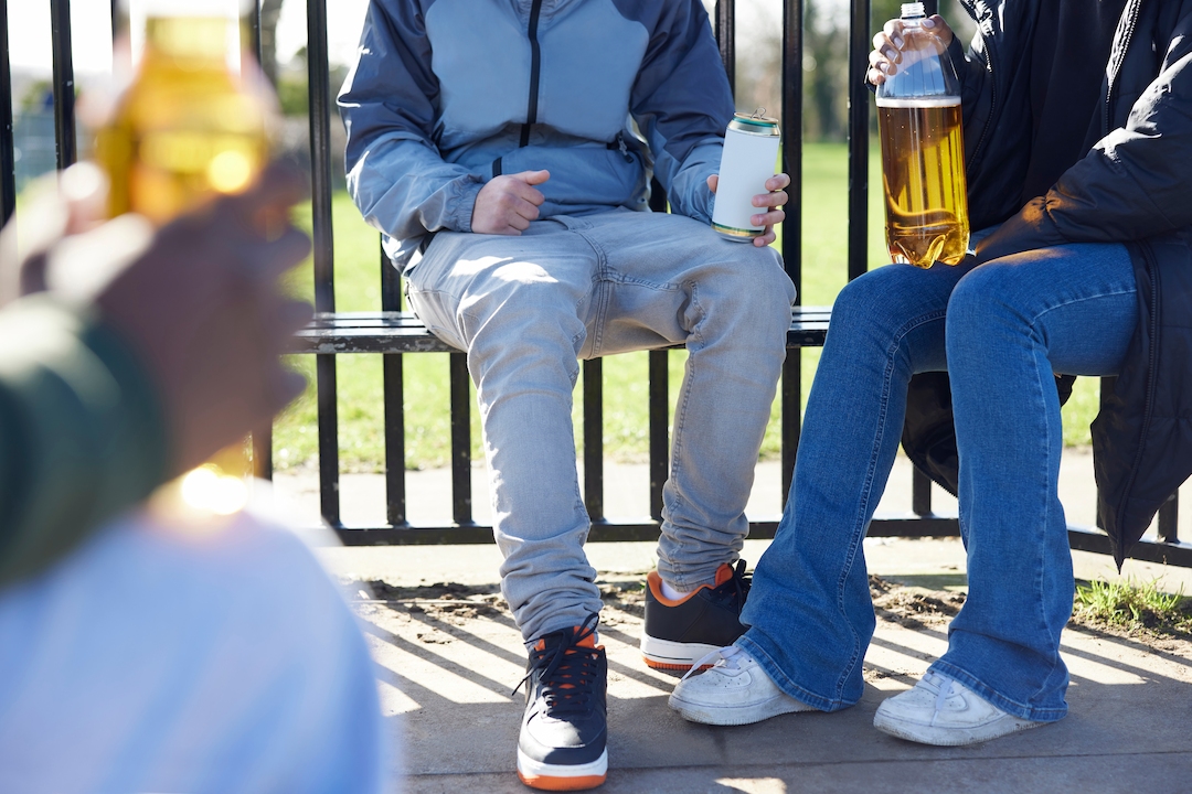 image of teenagers drinking in a park