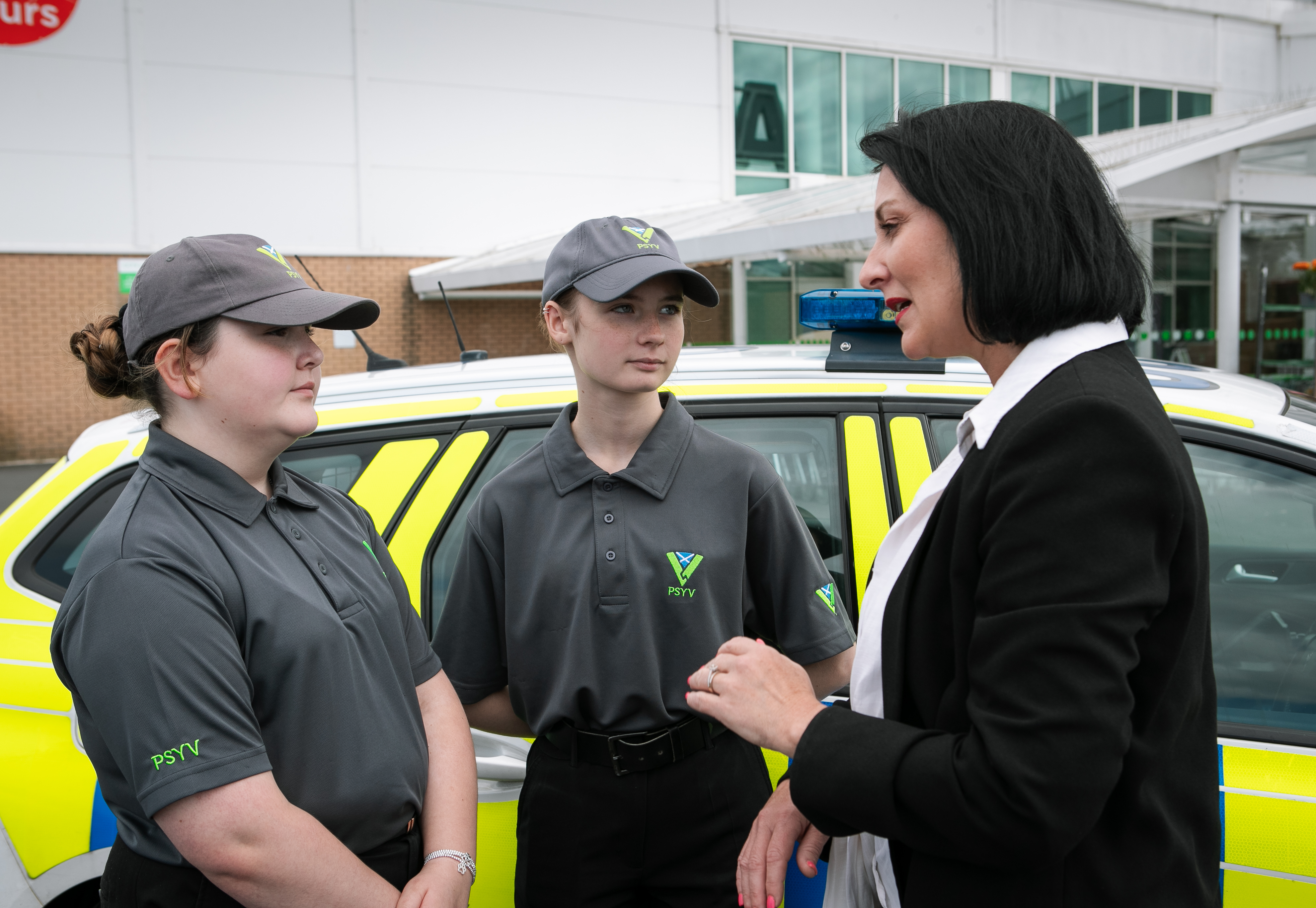 Community Safety Minister with 2 youths from Police Scotland Youth Volunteers